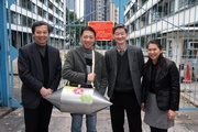 From left: Vice Chairman of HULU Culture K T Poon; Project Director of HULU Culture Simon Go; The Hong Kong Jockey Club’s Executive Director, Charities, William Y Yiu; and Executive Director of HULU Culture Iman Fok photo at the former Police Married Quarters on Hollywood Road.  The olive-shaped container with the abbreviation of 